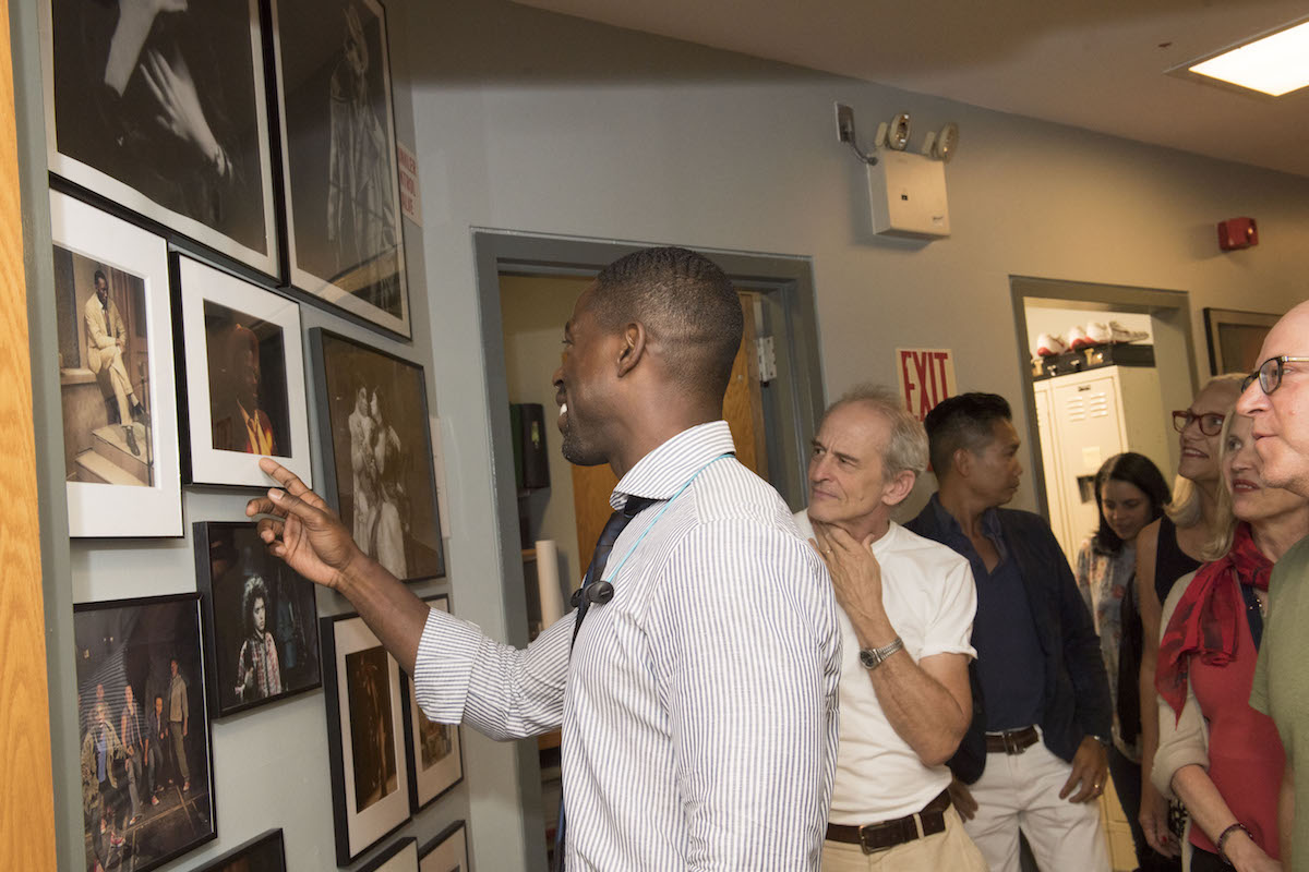 Sterling K. Brown finds his photo on the alumni wall.